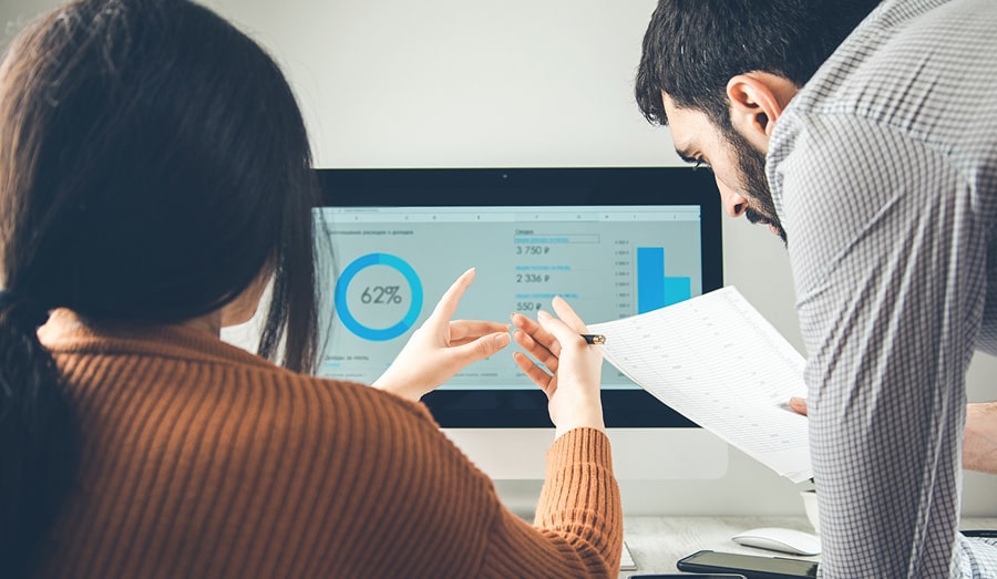 Two people working at a computer